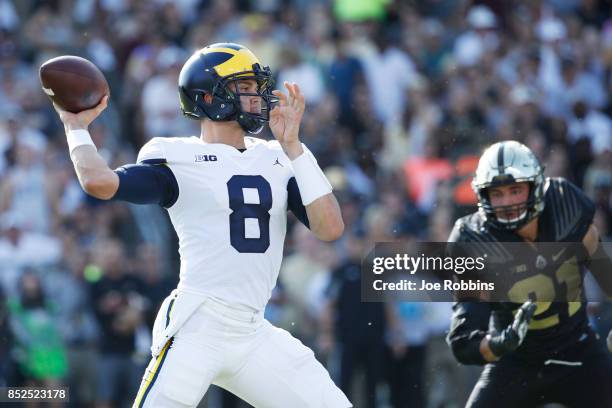 John O'Korn of the Michigan Wolverines throws a pass in the first quarter of a game against the Purdue Boilermakers at Ross-Ade Stadium on September...