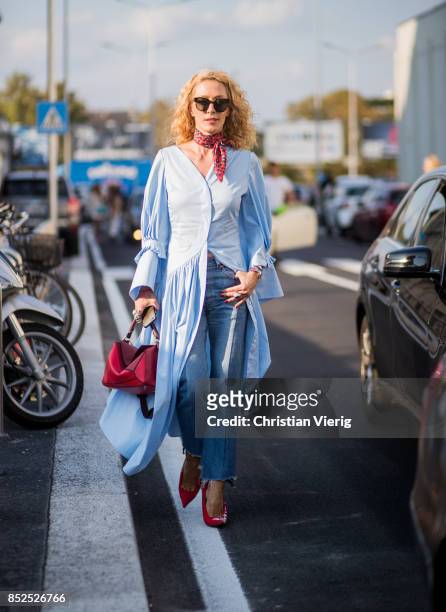 Elina Halimi wearing blue button dress is seen outside Missoni during Milan Fashion Week Spring/Summer 2018 on September 23, 2017 in Milan, Italy.
