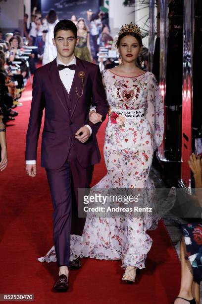 Hero Fiennes Tiffin and Laura Murray walk the runway at the Dolce & Gabbana secret show during Milan Fashion Week Spring/Summer 2018 at Bar Martini...