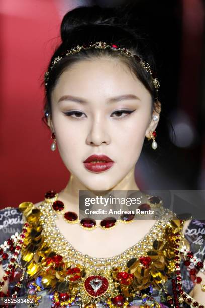 Natasha Lau walks the runway at the Dolce & Gabbana secret show during Milan Fashion Week Spring/Summer 2018 at Bar Martini on September 23, 2017 in...