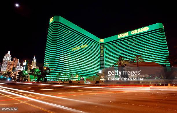 Lights from passing vehicles are seen in front of the New York-New York Hotel & Casino and the MGM Grand Hotel/Casino March 4, 2009 in Las Vegas,...