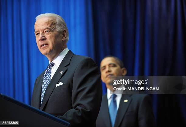 Vice President Joe Biden speaks as US President Barack Obama looks on at the Department of Transportation March 03, 2009 in Washington, DC. Obama...