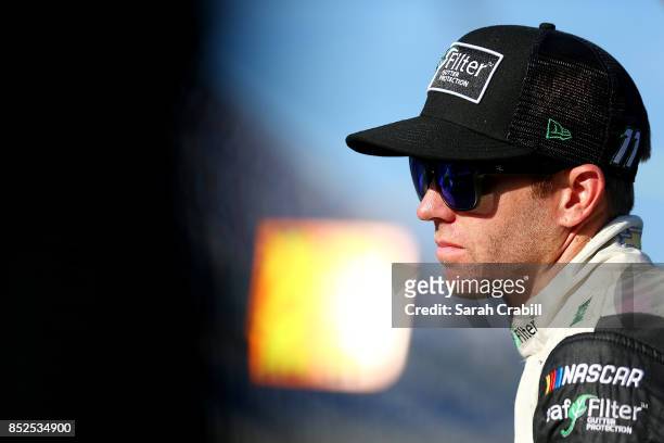 Blake Koch, driver of the LeafFilter Gutter Protection Chevrolet, looks on from the grid during qualifying for the NASCAR XFINITY Series...
