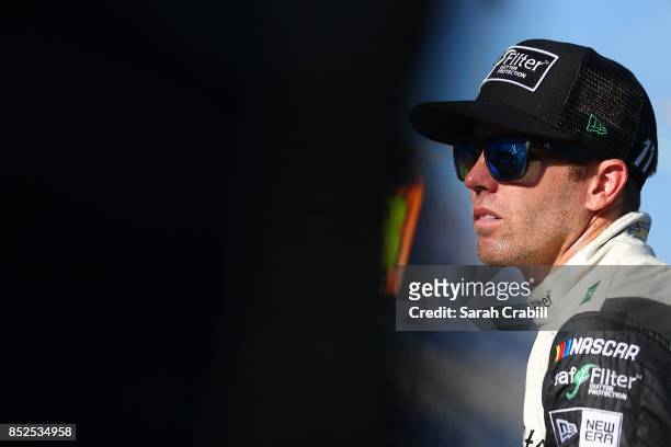 Blake Koch, driver of the LeafFilter Gutter Protection Chevrolet, looks on from the grid during qualifying for the NASCAR XFINITY Series...
