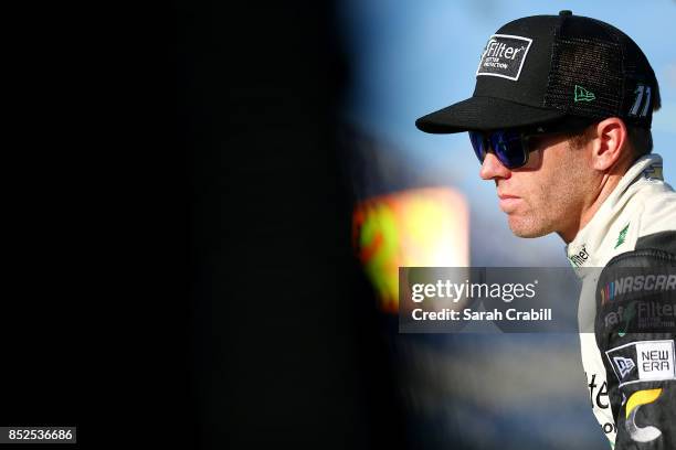 Blake Koch, driver of the LeafFilter Gutter Protection Chevrolet, looks on from the grid during qualifying for the NASCAR XFINITY Series...