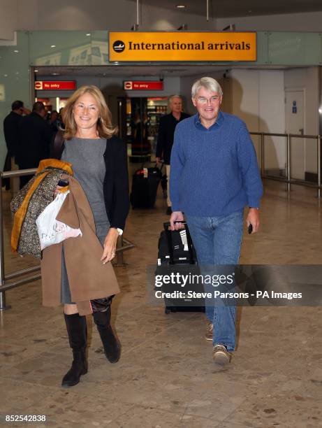 Andrew Mitchell and his wife Sharon at Terminal 1 in Heathrow airport in London after returning from Washington.