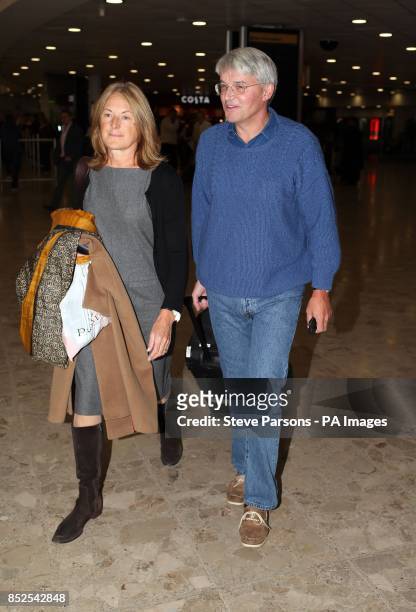 Andrew Mitchell and his wife Sharon at Terminal 1 in Heathrow airport in London after returning from Washington.