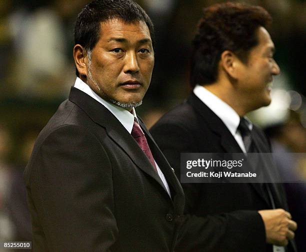 Ex professional baseball player Kazuhiro Kiyohara looks on the warms up prior to the World Baseball Classic match between Japan and China at Tokyo...