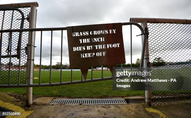 Novel Keep off the Grass sign is displayed at St James Park prior to the FA Cup, Fourth Qualifying Round match at St James Park, Brackley.