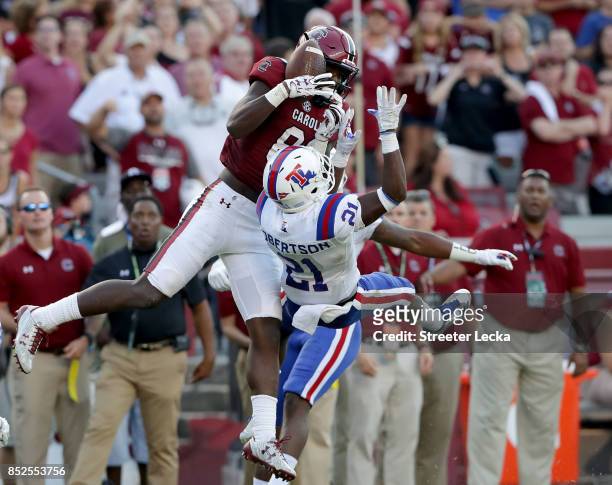 Bryan Edwards of the South Carolina Gamecocks catches a pass over Amik Robertson of the Louisiana Tech Bulldogs uring their game at Williams-Brice...