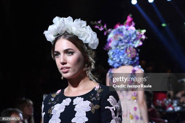 Amber Le Bon walks the runway at the Dolce & Gabbana secret show during Milan Fashion Week Spring/Summer 2018 at Bar Martini on September 23, 2017 in...