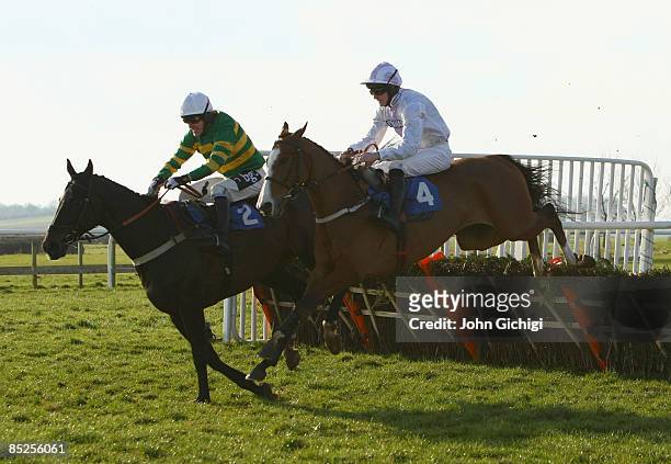 Simply Blue ridden by Andrew Glassonbury jumps the last to go on to win The Steven & Roy Hanney Memorial Handicap Hurdle Race at Wincanton Races on...