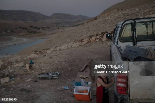 Young boy waits for is mother to dry off after swimming in Lake Dukan ahead of the upcoming referendum for independence of Kurdistan on September 23,...