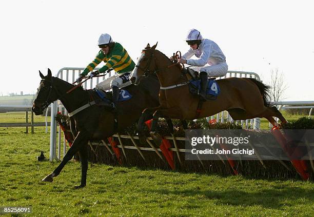 Simply Blue ridden by Andrew Glassonbury jumps the last to go on to win The Steven & Roy Hanney Memorial Handicap Hurdle Race at Wincanton Races on...