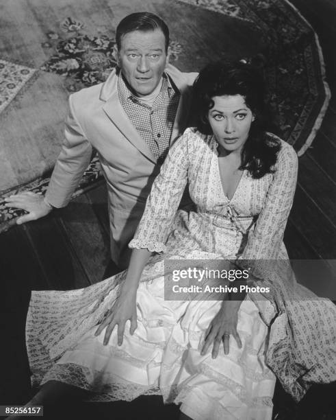 American actor John Wayne plays the lead character in the film 'McLintock!', alongside Yvonne de Carlo , 1963.