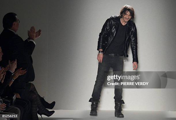 French designer Christophe Decarnin for Balmain acknowledges thepublic at the end of his autumn/winter 2009 ready-to-wear collection show in Paris,...
