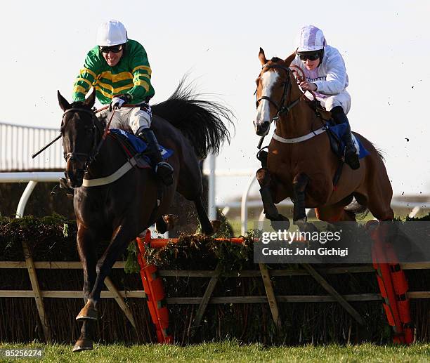 Simply Blue ridden by Andrew Glassonbury jumps the last to go on to win The Steven & Roy Hanney Memorial Handicap Hurdle Race at Wincanton Races on...