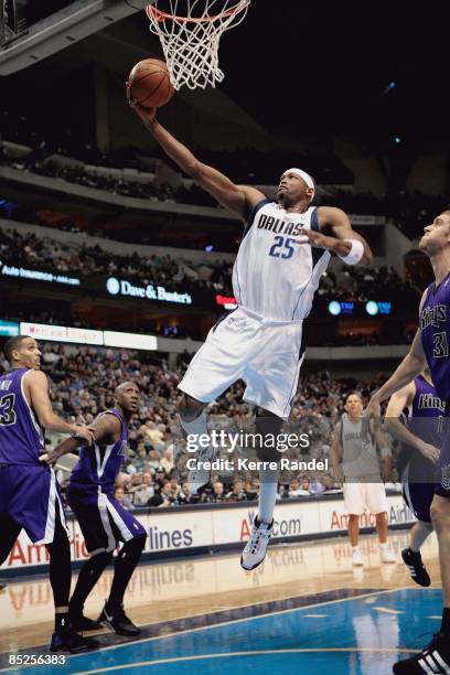 Erick Dampier of the Dallas Mavericks lays up a shot during the game against the Sacramento Kings on February 21, 2009 at American Airlines Center in...