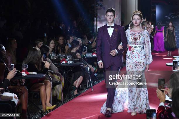 Hero Fiennes Tiffin and Laura Murray walk the runway at the Dolce & Gabbana secret show during Milan Fashion Week Spring/Summer 2018 at Bar Martini...