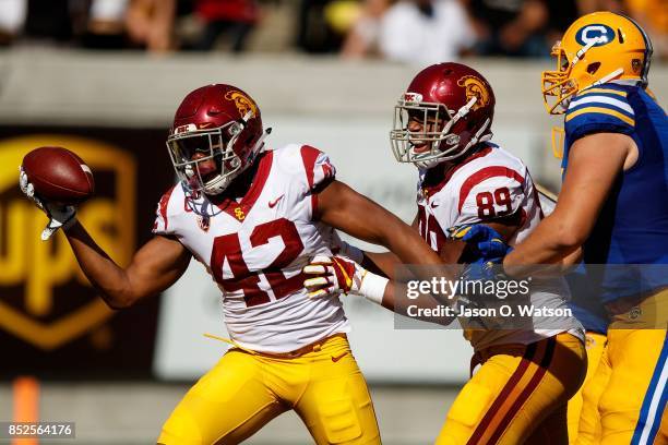 Linebacker Uchenna Nwosu of the USC Trojans celebrates after recovering a fumble during the fourth quarter against the California Golden Bears at...