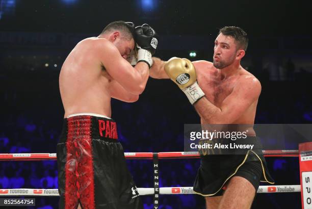 Hughie Fury lands a right shot on Joseph Parker during the WBO World Heavyweight Title fight at Manchester Arena on September 23, 2017 in Manchester,...