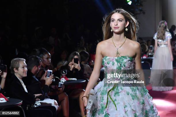 Model walks the runway at the Dolce & Gabbana secret show during Milan Fashion Week Spring/Summer 2018 at Bar Martini on September 23, 2017 in Milan,...