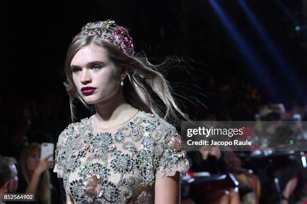 Model walks the runway at the Dolce & Gabbana secret show during Milan Fashion Week Spring/Summer 2018 at Bar Martini on September 23, 2017 in Milan,...