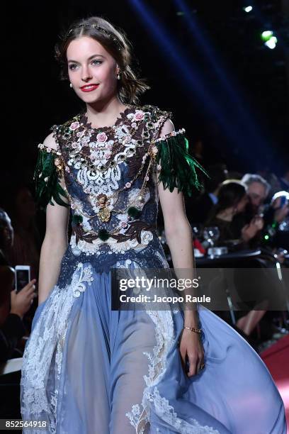 Model walks the runway at the Dolce & Gabbana secret show during Milan Fashion Week Spring/Summer 2018 at Bar Martini on September 23, 2017 in Milan,...