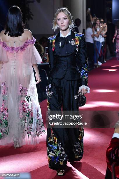 Model walks the runway at the Dolce & Gabbana secret show during Milan Fashion Week Spring/Summer 2018 at Bar Martini on September 23, 2017 in Milan,...