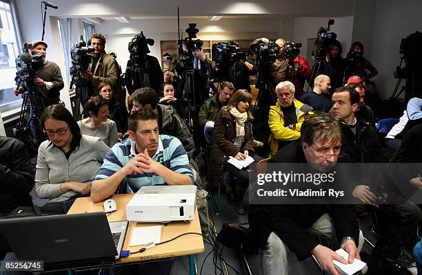 Media representatives are seen during the press conference held after the colapse of the building of the Historical Archive of the City of Cologne on...