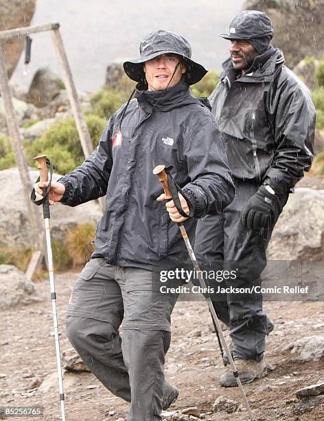 Gary Barlow treks into camp in the rain on the fifth day of The BT Red Nose Climb of Kilimanjaro on March 5, 2009 in Arusha, Tanzania. Celebrities...