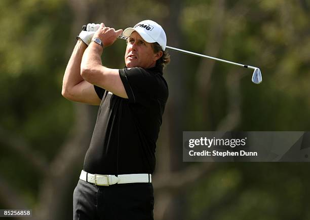 Phil Mickelson hits his second shot on the first hole during the second round of the Northern Trust Open on February 20, 2009 at Riviera Country Club...