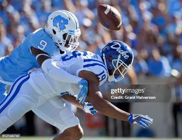 Sails of the North Carolina Tar Heels defends a pass to Quay Chambers of the Duke Blue Devils during their game at Kenan Stadium on September 23,...