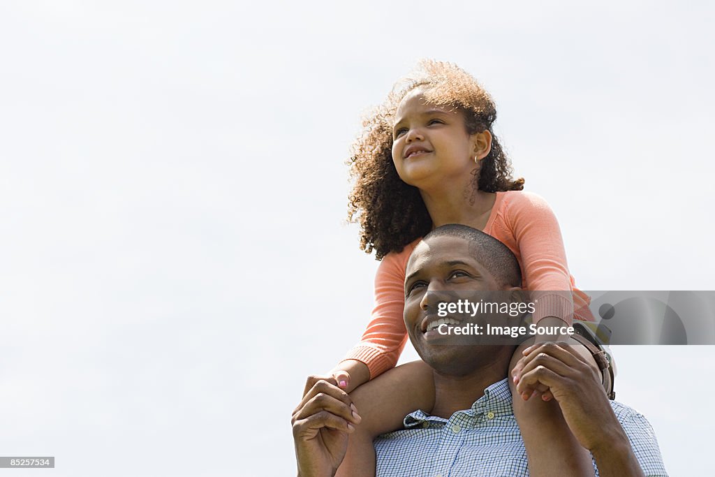 Man carrying daughter