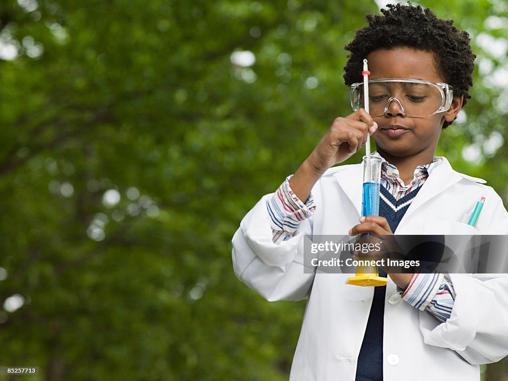 A boy doing an experiment