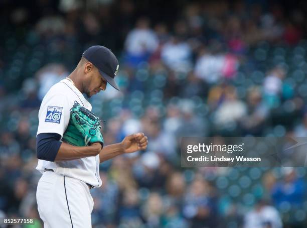 Ariel Miranda of the Seattle Mariners reacts after giving up a three run home run in the ninth inning to Yan Gomes of the Cleveland Indians at Safeco...
