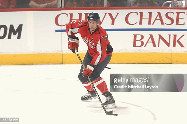 Tom Poti of the Washington Capitals looks to pass the puck during a NHL hockey game against the Atlanta Thrashers on February 26, 2009 at the Verizon...