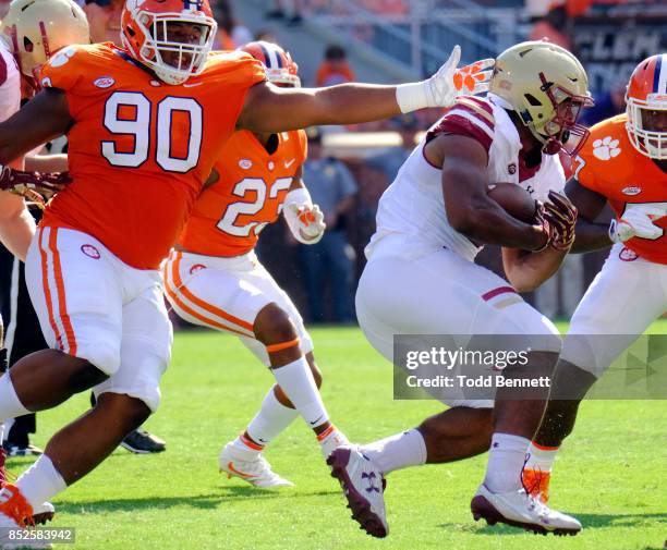 Defensive tackle Dexter Lawrence of the Clemson Tigers tries to grab running back AJ Dillon of the Boston College Eagles at Memorial Stadium on...