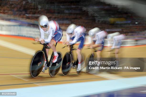 Great Britain's Owen Doull, Ed Clancy, Steven Burke and Andy Tennant on their way to winning gold in the Men's Team Pursuit, during day one of the...