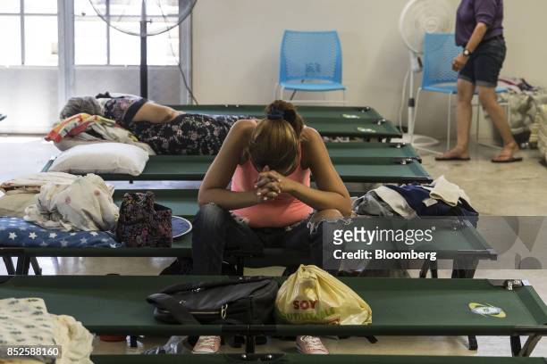 Resident sits inside a shelter after being evacuated from a home near the damaged Guajataca Dam after Hurricane Maria in Isabela, Puerto Rico, on...