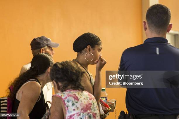 Resident wait inside a shelter after being evacuated from a home near the damaged Guajataca Dam after Hurricane Maria in Isabella, Puerto Rico, on...