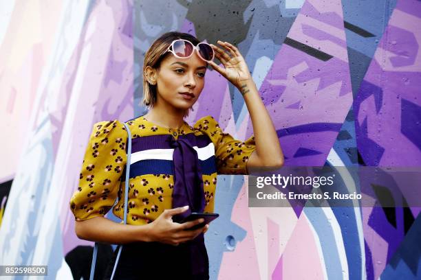 Artist and actress Kat Graham wears Roksanda top, Racine Carree shoes, Elisabetta Franchi purse during Milan Fashion Week Spring/Summer 2018 on...