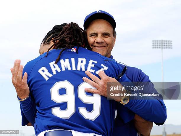 Manny Ramirez of the Los Angeles Dodgers hugs manager Joe Torre during a news conference on March 5 at Camelback Ranch in Glendale, Arizona, after he...