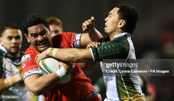 Tonga's Konrad Hurrell and Cook Island's Brad Takairangi during the the 2013 World Cup match at Leigh Sports Village, Leigh.