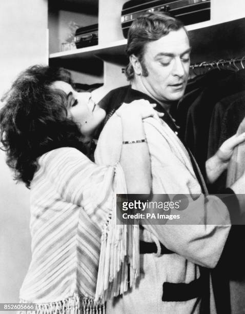 Michael Caine, as Robert Blakeley, and Elizabeth Taylor, as his onscreen wife Zee, in a film about a bickering couple whose marriage is on its last...