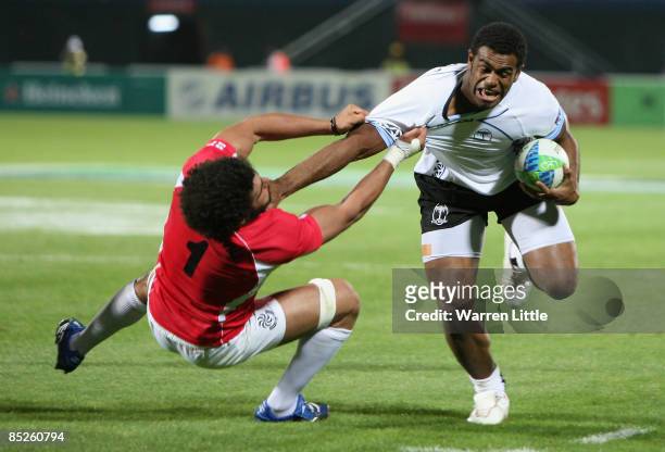 Napolinoi Nalaga of Fiji is tackled during the Pool B match between Fiji and Georgia at the IRB Rugby World Cup Sevens 2009 at The Sevens stadium on...
