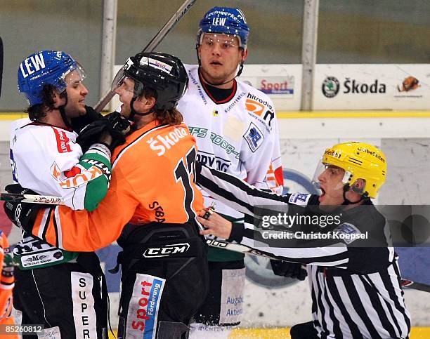 Sebastian Furchner of Grizzly Adams of Wolfsburg attacks Brett Engelhardt of the Augsburger Panther during the DEL 1st Pre-Play-Off match between...