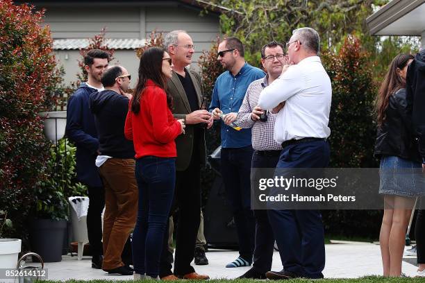 Labour Leader Jacinda Ardern talks with Labour Party MP Phil Twyford, Grant Robertson and deputy leader Kelvin Davis at her house on September 24,...