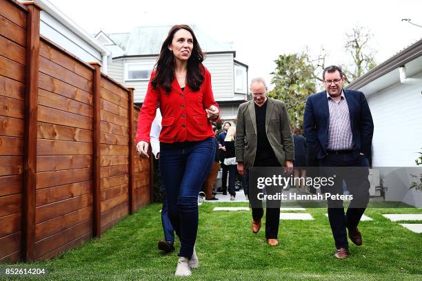 Labour Leader Jacinda Ardern, Labour Party MP Grant Robertson and deputy leader Kelvin Davis arrive to talk to the media during a bbq at her house on...