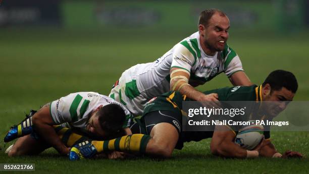 Ireland's Joshua Toole and Liam Finn battle with Australia's Jarryd Hayne during the 2013 World Cup match at Thomond Park, Limerick, Ireland.